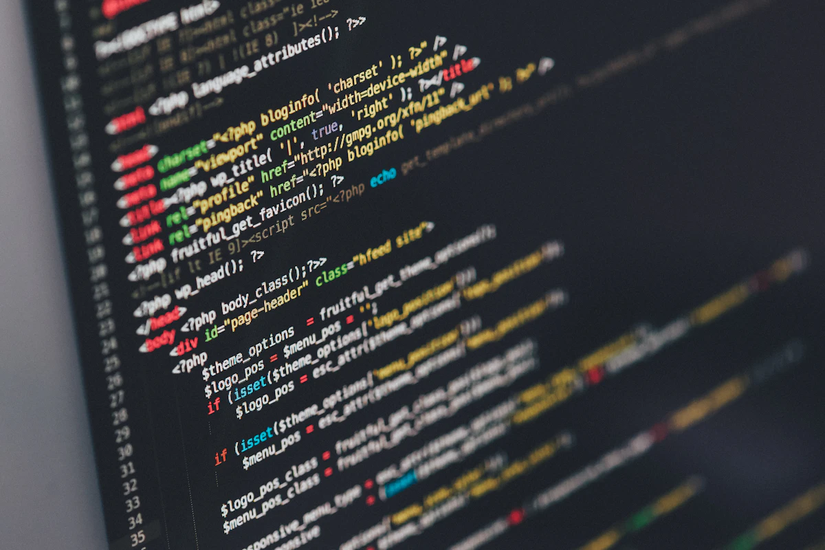 A developer working on custom software code on screen.