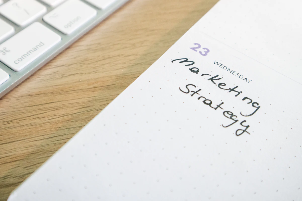 A fundraising campaign being planned out on a calendar and notebook.