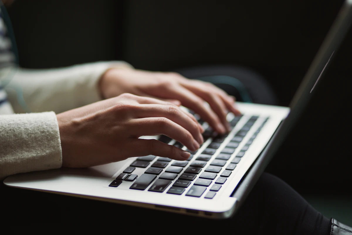 A person using a laptop keyboard, illustrating keyboard-only navigation.