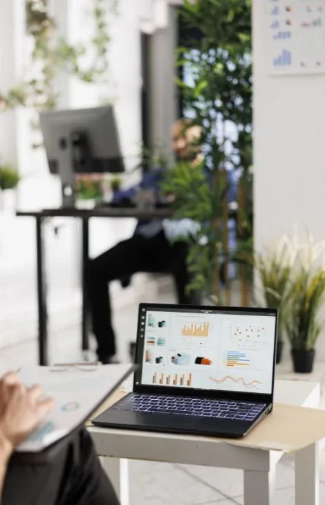 Business analytics dashboard on a laptop in an office