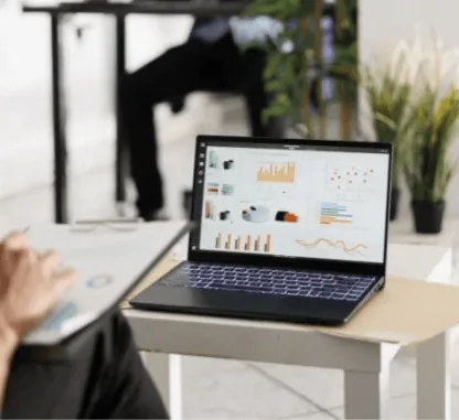Charity team reviewing donor analytics on a laptop